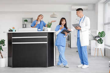 Medical interns working near reception in clinic