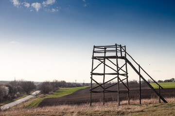 A bird watchtower stands amidst the natural landscape of Deliblatska Pe&scaron;čara in Banat, Vojvodina, Serbia, offering panoramic views for observing wildlife in this protected area known for its unique sa