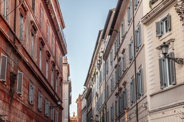 Selective blur on Old buildings and facades in the historic old Rome, Italy, the capital city of the country, and a major touristic landmark. Residential buildings are visible.