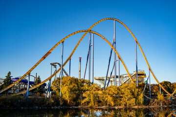 Naklejka premium Roller coasters at Canada's Wonderland. Canada's Wonderland is amusement park. Vaughan, Canada - November 2, 2024.