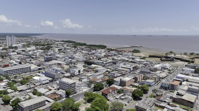Drone flies from downtown toward the Amazon River in the early afternoon in Macap&aacute;, Amap&aacute;, Brazil