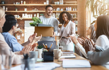 Friendly young multiracial team welcoming guy new employee, female manager introducing hired worker...