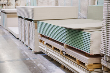  water repellent gypsum board on a rack in a hardware store. sale of building materials for repair...
