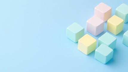 Obraz premium Pastel Cubes Arrangement on Soft Blue Background
