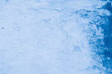 Grunge classic blue concrete background. Textured plaster wall. Creative backdrop for your design. Color of the year 2026 concept. Top view, layout for design. Surface with peeling shabby pattern.