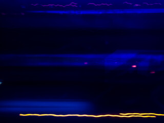Naklejka premium Abstract light art background with dynamic movement is the result of light painting photography capturing speed and energy with elegant lines of light.