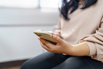 Woman shopping on Smartphone holding credit card for Internet online e-commerce shopping spending money Online shopping Mobile phone concept