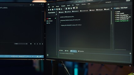 Programmer typing on computer to fix vulnerabilities in software enabling attackers to compromise systems. Woman taking care of security exposures in operating system, writing code, camera A close up