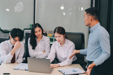 Frustrated upset multiracial business team people sad with bad work result in report disappointed in corporate bankruptcy failure crisis worried of paperwork problem sit at table at office meeting