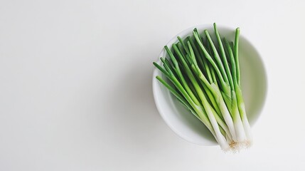 Fresh Green Onions in White Bowl on Light Background