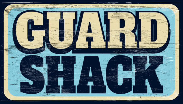 Aged retro guard shack sign on wood