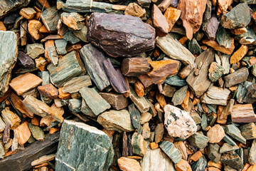 colorful stones on the bank of a mountain river