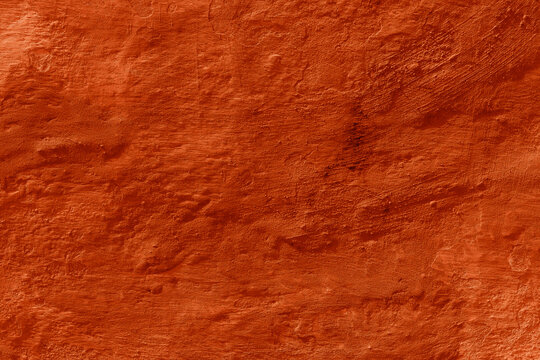 Grunge lush lava concrete background. Textured plaster wall. Creative backdrop for your design. Color of the year 2025 concept. Top view, layout for design. Surface with peeling shabby pattern.