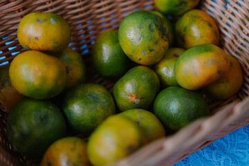 Fresh oranges piled in a bowl, showcasing vibrant color and juicy texture