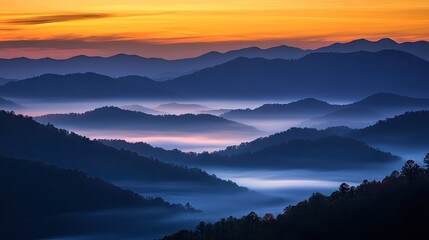 Obraz premium Serene Mountain Landscape at Sunrise with Mist