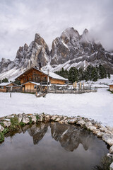 Woman enjoy the view of Geisler Alm, Adolf Munkel Trail, Nature Park, Dolomites Italy.