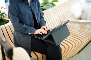 Young Professional Working on a Laptop in a Modern, Relaxed Space