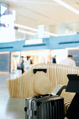 Stylish Waiting at the Airport: A Relaxing Travel Scene with Luggage and Accessories