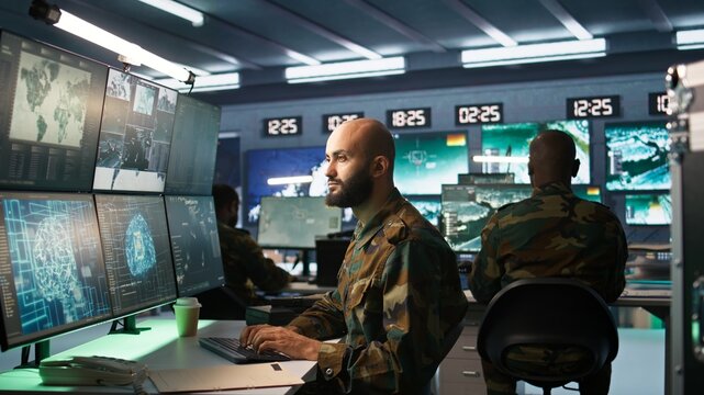 Army computer scientist employing AI technology in military planning and decision making processes. Expert uses artificial intelligence to enhance armed forces operational capabilities, camera B