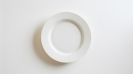 Empty white ceramic round plate isolated on white background. 