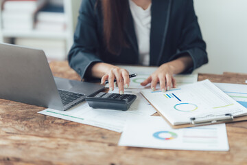 Focused on the Numbers: A business professional meticulously analyzes financial data, demonstrating concentration and dedication in a close-up shot that captures the essence of financial analysis. 