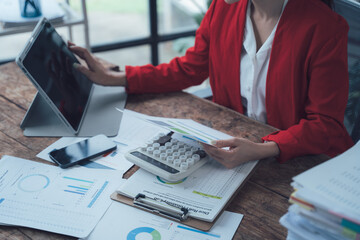 Businesswoman Analyzing Data:  A close-up image of a businesswoman meticulously analyzing data on...