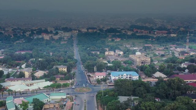 Highway and roundabout intersection in Jos Town, Nigeria on a hazy day - aerial