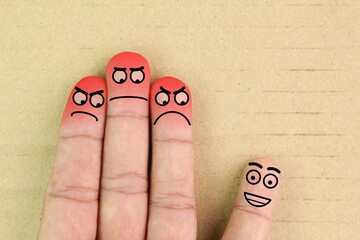 finger smileys with faces. Fingers art of people. Concept of loneliness, allocation from crowd. the...