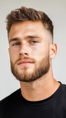 Fototapeta premium A man with a beard and a shaved head