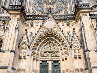 Fototapeta premium The bottom part of main facade of St Vitus Cathedral near New Royal Palace in Prague in Czech Republic