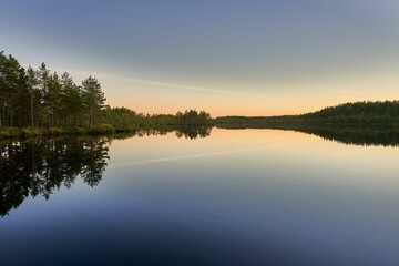 Serene lake reflection at twilight.