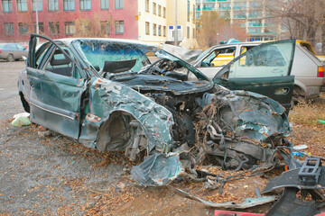 Broken bumper and hood of a car as a result of a collision with a pole, close-up. The car crashed into a lamp post. car accident. DNIPRO, UKRAINE - August 12, 2023