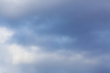 White heap clouds in the blue peaceful sky. The concept of psychological calmness and health. Peace of mind with the forces of nature. Air travel concept.
