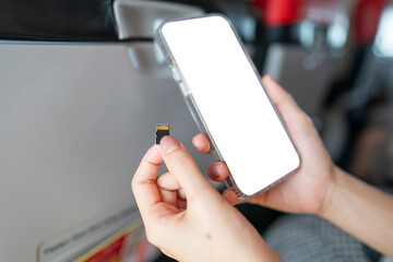 Hand with white blank mobile phone screen mockup with Micro sd card