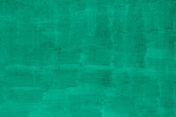 Obraz premium Grunge neo mint concrete background. Textured plaster wall. Creative backdrop for your design. Color of the year 2025 concept. Top view, layout for design. Surface with peeling shabby pattern.