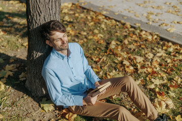 Finding peace by the lake, a man takes a moment to relax in nature