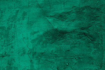 Grunge neo mint concrete background. Textured plaster wall. Creative backdrop for your design. Color of the year 2025 concept. Top view, layout for design. Surface with peeling shabby pattern.