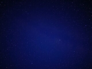 Celestial view at night with stars in shades of blue and purple, nebula, cosmos