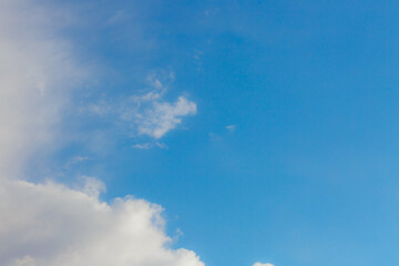 White heap clouds in the blue peaceful sky. The concept of psychological calmness and health. Peace of mind with the forces of nature. Air travel concept.