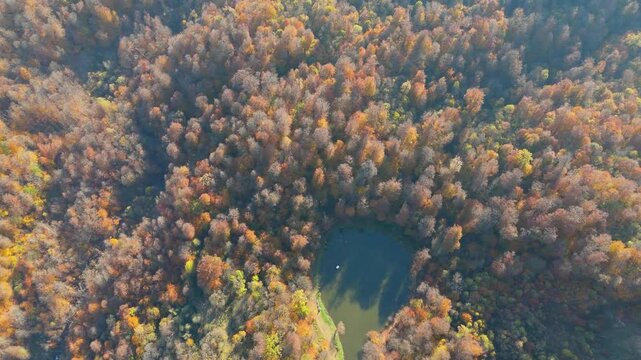 Colorful view of the autumn forest with lake. Parz Lake in Tavush, Armenia. Taken with a drone