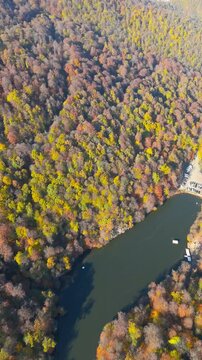 Colorful view of the autumn forest with lake. Parz Lake in Tavush, Armenia. Taken with a drone