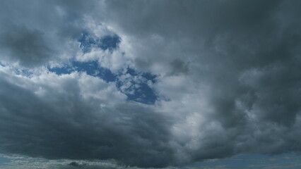 Obraz premium Gray Rainy Clouds Float Across Dark Sky. Tornado Clouds. Natural Background. Rainy Sky.