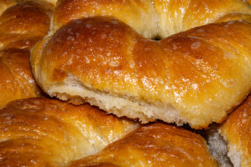 Close-up food photography of baked yeast dough buns in a round shape.