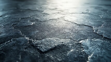 A close-up view of a textured, cracked surface with a subtle sheen.