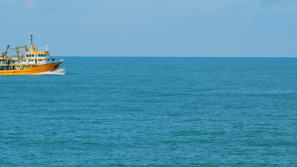 Fishing Boat On The Horizon At Sea. Abstract Small Waves On Calm Water Surface In Motion. Real time. © artifex.orlova