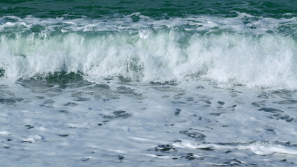 Seashore On Beach. Relaxing Travel Concept. Ocean Waves Crashing And Foaming. Slow motion.