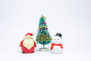 Cute little snow man and Santa Clause with Christmas tree over blurred white background, Christmas card background idea