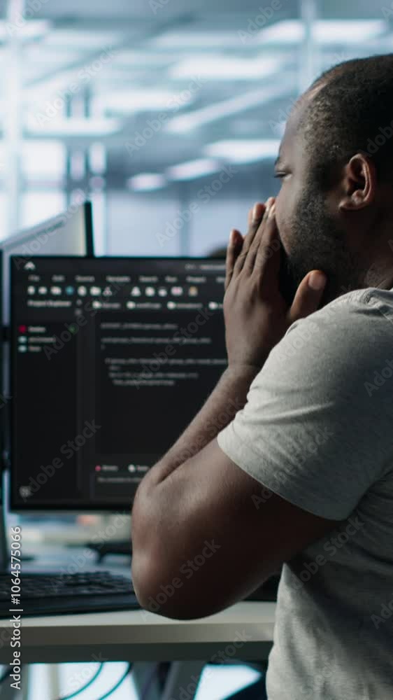 Poster admin working in computer network security data center suffering from cold, sneezing. ill african am
