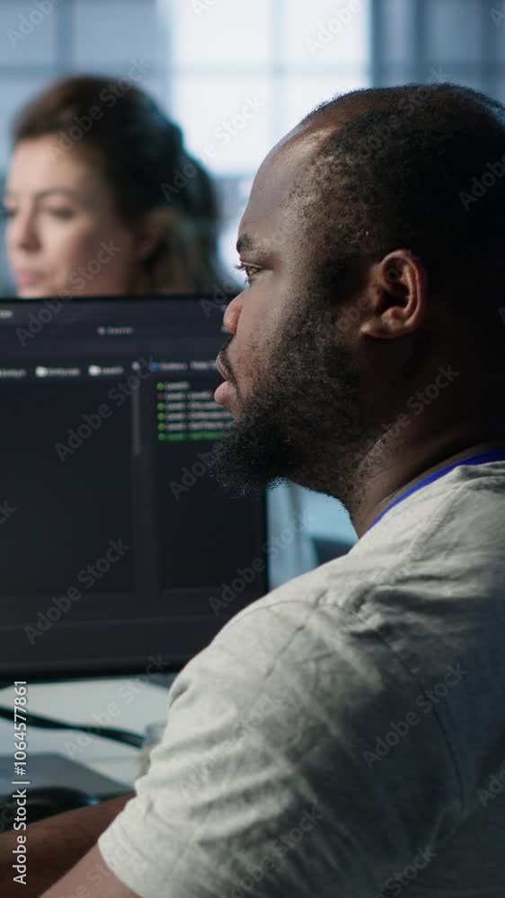 Poster admin in server hub tasked with protecting valuable data against hacking attack on computers. africa