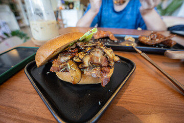 Close-up image of delicious mushroom burger serve on plate